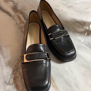 Sleek Black Leather Flats with Modern Metallic Detail